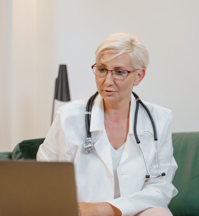 Physician on a telehealth videoconference consult
